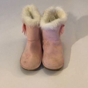 Girls pink boots.